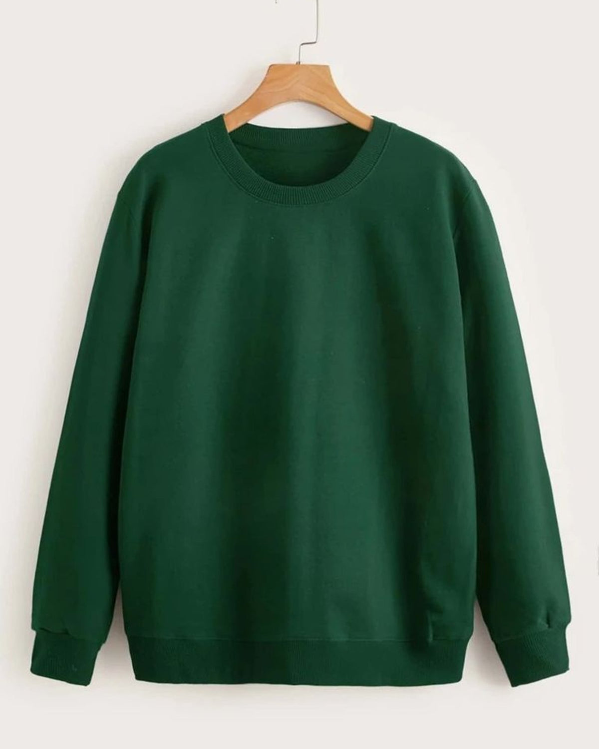 LUSH crewneck sweatshirt in Emerald Green on a hanger